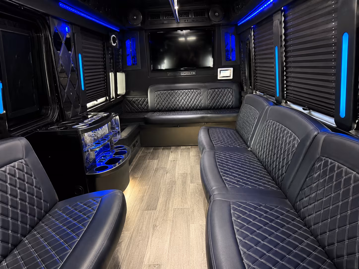 Friends laughing during a party bus celebration in Yonkers